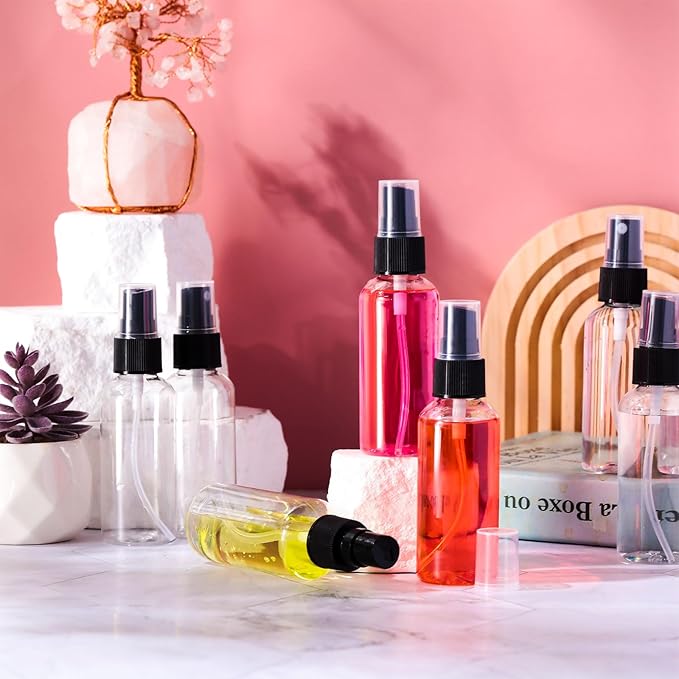 Roshtia 200 Pcs 2 oz Plastic Mini Spray Bottles with Black Cap Clear Empty Fine Mist Spray Bottles Refillable Liquid Container for Essential Oils Perfumes Travel Makeup